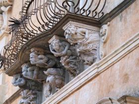 masks of palazzo Cosentini in Ragusa Ibla
