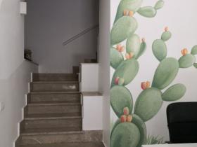 prickly pear draw in the wall of the reception