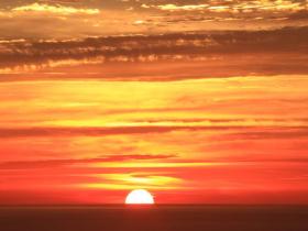 red sunset over the sea in Ragusa