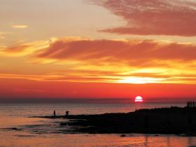 sunset on the beach rocks in Marina di Ragusa